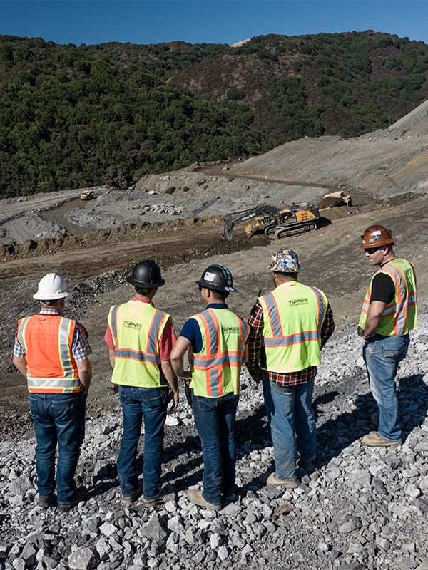 Group of Turner Mining employees overlooking a mine